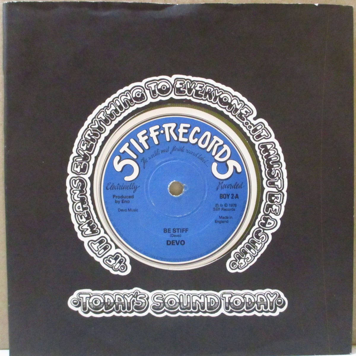 DEVO (ディーヴォ) - Be Stiff (UK 限定「クリアイエローヴァイナル」 7インチ+カンパニースリーブ)