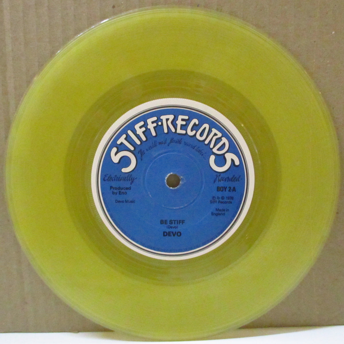 DEVO (ディーヴォ) - Be Stiff (UK 限定「クリアイエローヴァイナル」 7インチ+カンパニースリーブ)
