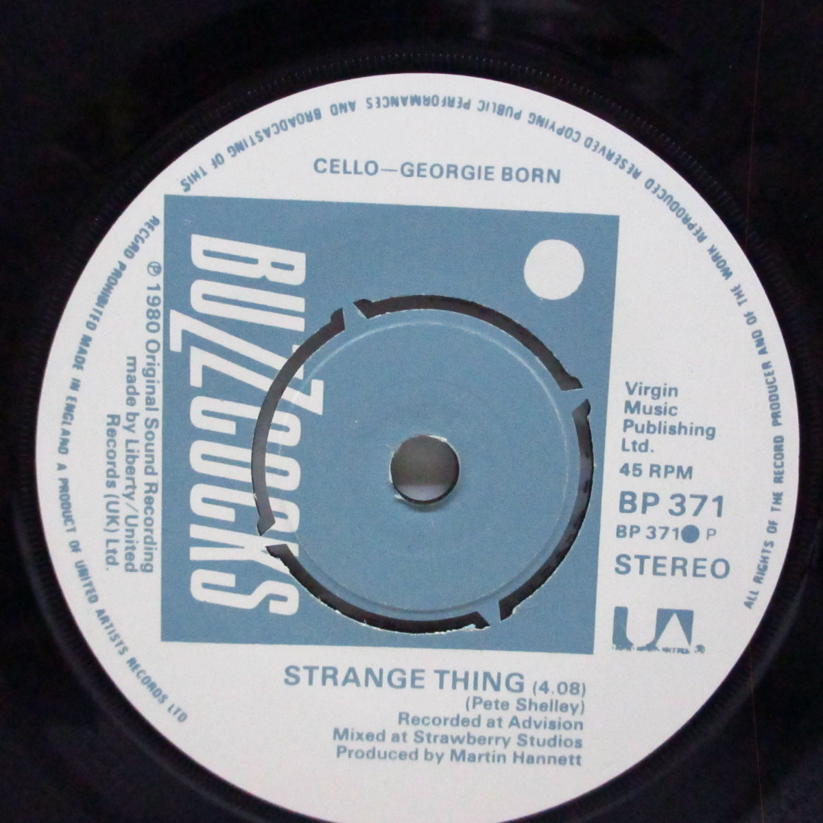 BUZZCOCKS (バズコックス)  - Strange Thing (UK オリジナル「ラウンドセンター」7"/光沢ソフト紙折り返しジャケ) グループ写真が表バージョン !