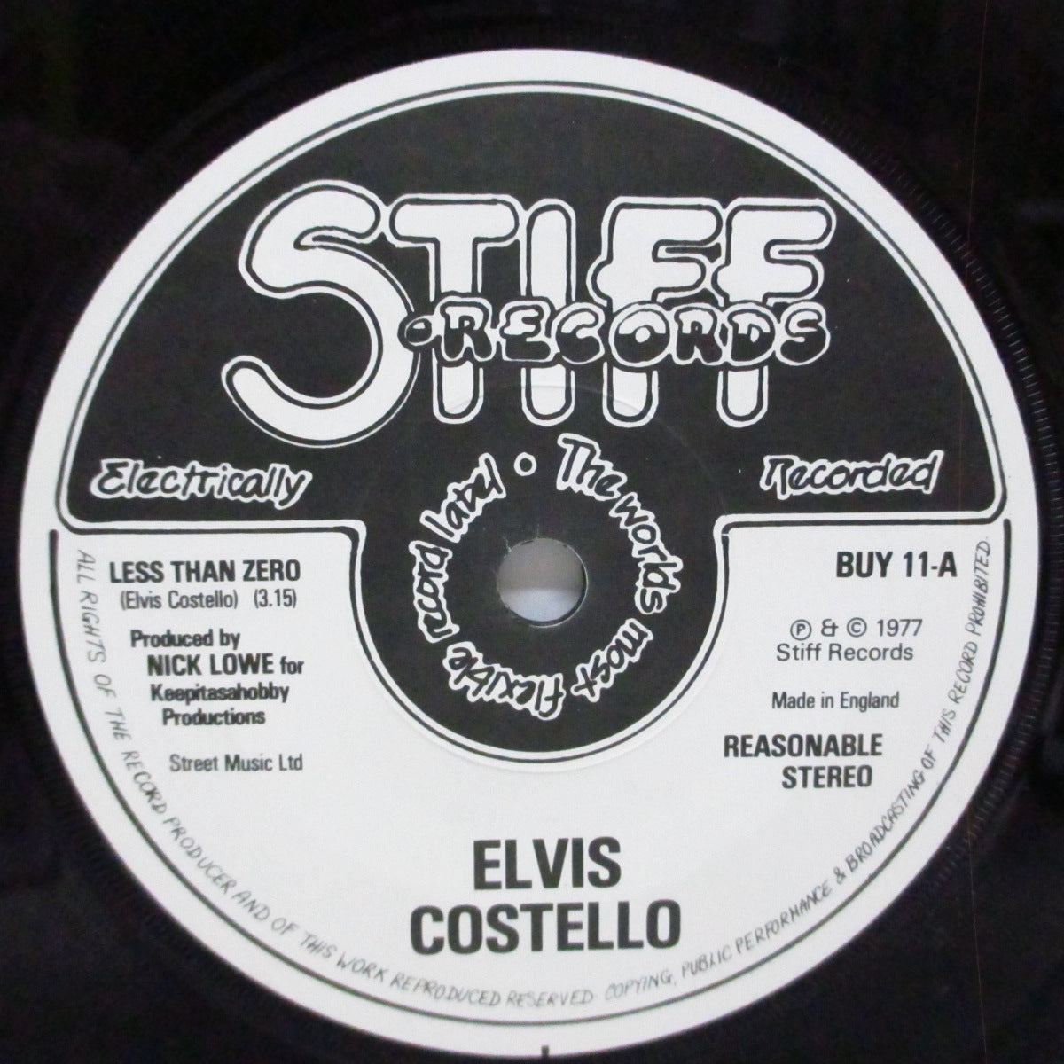 ELVIS COSTELLO  (エルヴィス・コステロ)  - Less Than Zero (UK '81 再発 7"/マットソフト紙折り返ジャケ) 「Stiff Singles Four Pack (GRAB 3)」からのバラ売りバージョン !